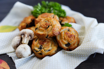 Muffins with cheese and mushrooms (close-up)