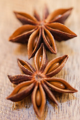anise stars on a wood background closeup