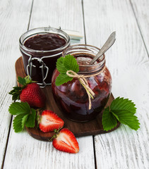 Strawberry jam and fresh strawberries