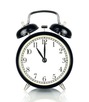 Alarm Clock isolated on white, in black and white, eleven o'clock.