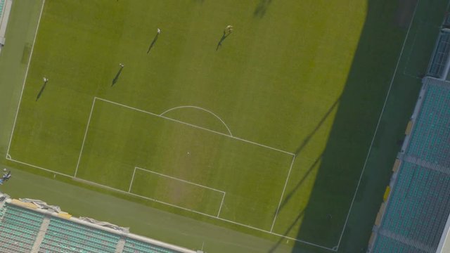 Aerial, playing and kicking ball around at Soccer Stadium
