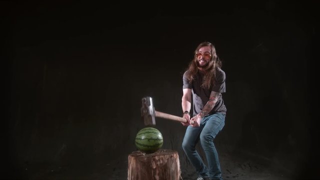 Man smashing watermelon with hammer in slow motion, shot on Phantom Flex 4K at 1000 fps