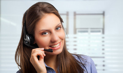 Portrait of a gorgeous woman using an headset