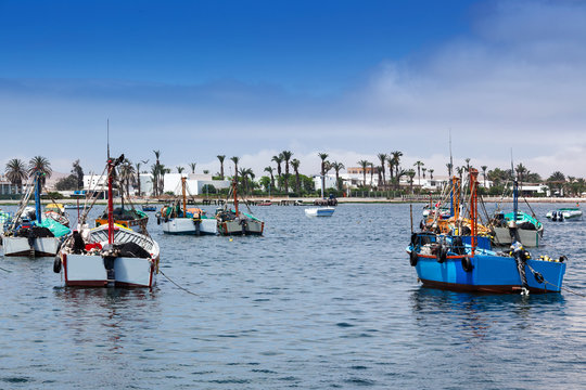 fishing boats in ocean bay