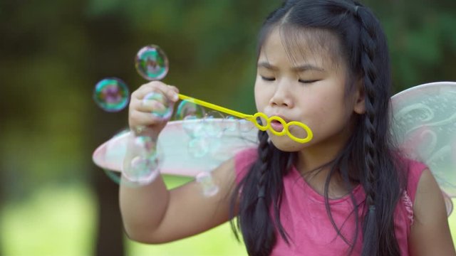 Girl in fairy princess costume blowing bubbles, shot on Phantom Flex 4K