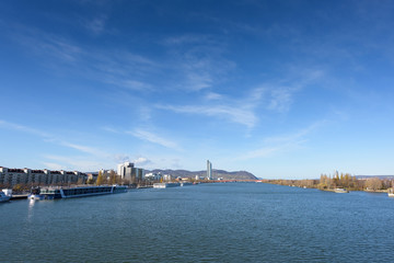 Fototapeta na wymiar Danube river view with ferryboat in Vienna, Austria