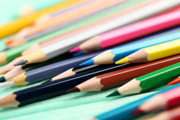 Fototapeta premium Drawing colourful pencils on a wooden background