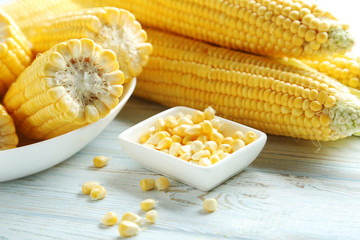 Sweet corns on a white wooden table