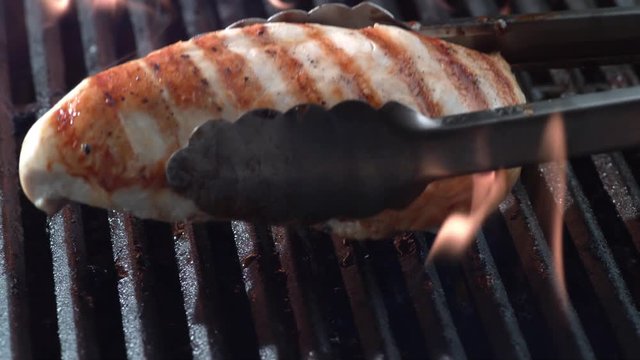Grilled chicken breast on grill