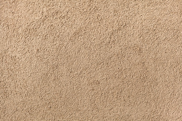 Beige painted stucco wall. Background texture