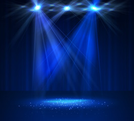 Spotlight on stage with smoke and light.