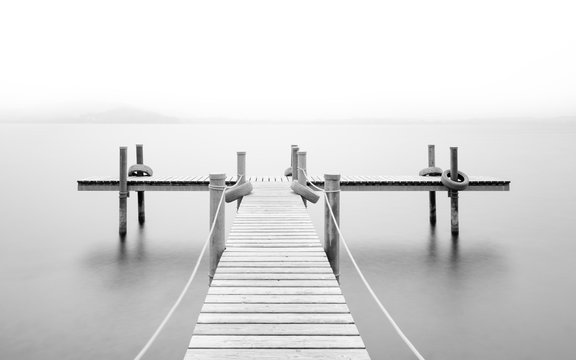 Wooden pier on the lake. Fog. Long exposure. Black and White. © patma145