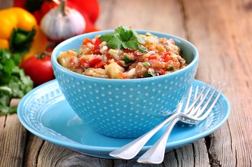 Appetizer (salad) of roasted eggplant, peppers, tomatoes, onions, garlic and coriander.