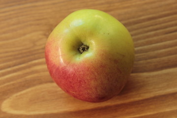 Apple on a wooden table.