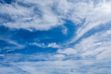 Fototapeta premium Beautiful white clouds at a blue sky. Can be used for background, wallpaper, etc. 