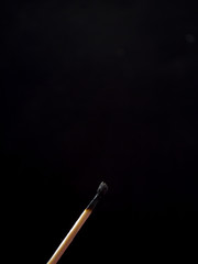 stewed match against a dark background