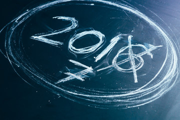 2016 crossed and new years 2017 on chalkboard