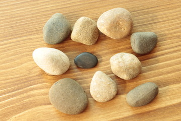 Stones on a wooden table.