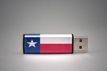 usb flash drive with the texas state flag of on gray background.