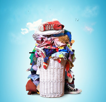 White straw basket full of dirty Laundry