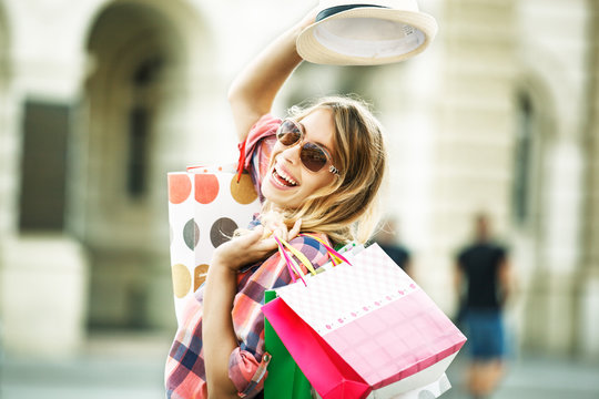Beautiful young woman enjoying shopping.