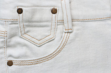 close up detail of white denim trousers