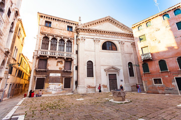 Bright colored house in Venetian style in San Beneto square in Venice in the evening. Campo San...