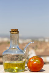 Obraz premium oil and tomato with the city in the background