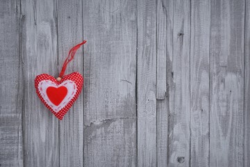Handmade Valentine heart on wooden wall