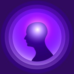 Silhouette of the human head with glowing brain.