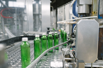 Water factory - Water bottling line for processing and bottling pure spring water into green glass small bottles.