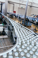 Water factory - Water bottling line for processing and bottling pure spring water into white glass bottles.