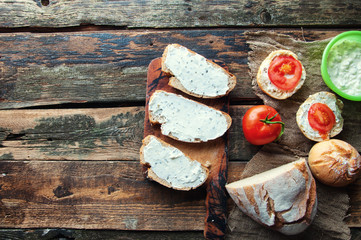 Sandwiches with cream cheese with chives wooden background. from