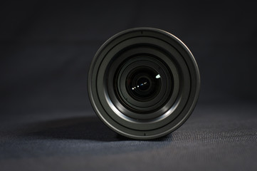 Digital Cinema Camera lens on a black table top.