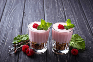 Dessert with granola, yogurt and raspberry
