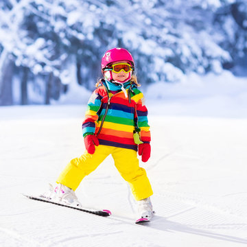 Little girl skiing in the mountains