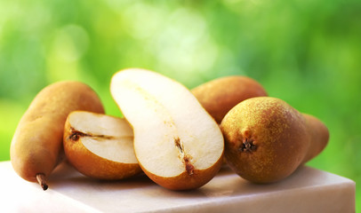 Abate Fetel pears on green background
