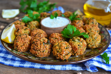 Falafel - deep fried balls of ground chickpeas with tahini sauce