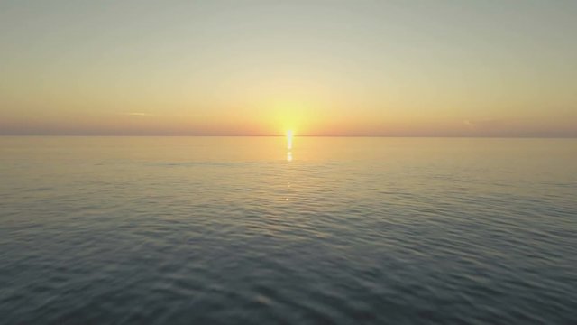 Epic aerial of ocean sunrise.  Fast flying reveal of Bathtub Reef Beach in Stuart, Florida.