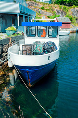 Fototapeta na wymiar Vintage fishing boat in harbor