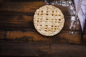 A lattice-top caramel apple pie before baking