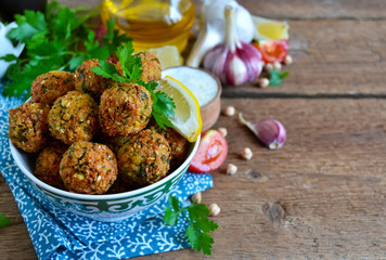 Falafel - deep fried balls of ground chickpeas with tahini sauce