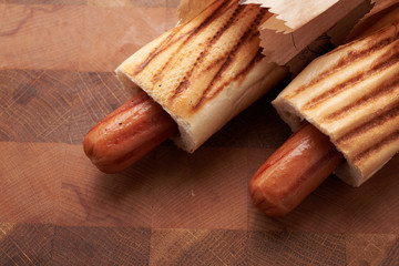 Two hot dogs lying on the table
