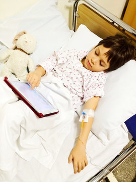  Using tablet on hospital bed