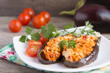 Baked stuffed eggplant with meat, vegetables and cheese.