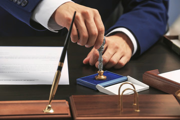 Notary public in office stamping document