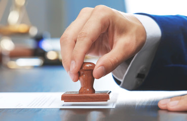 Notary public in office stamping document