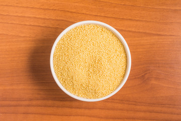Ground Wheat into a spoon. Trigo para quibe. Kibbeh