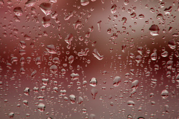 Glass with drops of rain water