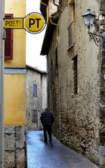 Turano lake (Rieti, Italy) and the town of Castel di Tora in a winter day, with snowy peaks